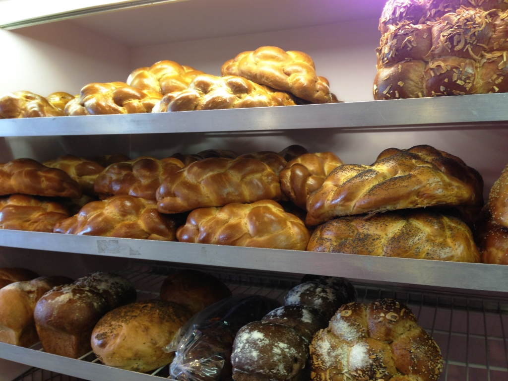 Racks of fresh challah at Zadies Bakeshop